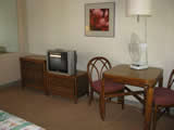 Dining area in a poolside studio of The Breakers Hotel at Waikiki Beach